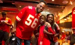 Texas Ex Derrick Johnson with students